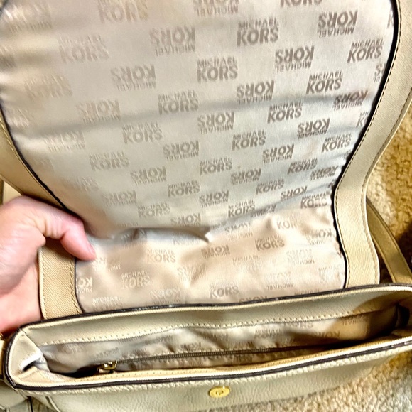 Michael Khor’s beige leather crossbody purse. - Picture 4 of 4